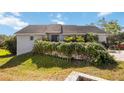 Attractive single-Gathering home with well-maintained lawn and lush landscaping at 2458 Whippoorwill Cir, Sarasota, FL 34231