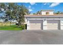 Detached garage featuring multiple spaces, well-maintained landscaping, and easy access at 400 San Lino Cir # 431, Venice, FL 34292