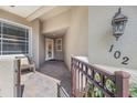 Inviting entryway with paver flooring, updated light fixture, and unit number at 6409 Moorings Point Cir # 102, Lakewood Ranch, FL 34202