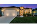 Charming single-story home featuring a two-car garage, landscaped front yard and covered entrance with ample natural light at 2930 61St E Dr, Ellenton, FL 34222