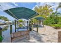 Private boat dock with lifts for convenient water access and beautiful waterfront living at 121 Holly Ave, Sarasota, FL 34243