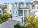Charming two-story blue home with white shutters and a brick driveway at 12917 42Nd W Ter, Cortez, FL 34215