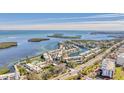 Aerial view of the community showcasing waterfront homes, canals, and scenic coastal surroundings at 4350 Chatham Dr # E106, Longboat Key, FL 34228
