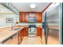 Well-equipped kitchen with stainless steel appliances and granite countertops at 559 Bahia Beach Blvd, Ruskin, FL 33570