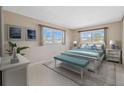 Bright bedroom with large windows, white furniture, and stylish blue accents creating a relaxing atmosphere at 2762 W Vina Del Mar Blvd, St Pete Beach, FL 33706