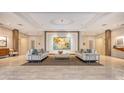 Elegant condo lobby featuring contemporary furnishings, a neutral color palette, and recessed lighting at 3060 Grand Bay Blvd # 154, Longboat Key, FL 34228