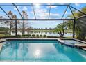 Screened in pool and spa overlooking beautiful golf course and water at 15608 Leven Links Pl, Lakewood Ranch, FL 34202