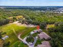 A single story home on a large lot surrounded by green space and a long winding driveway at 1817 Curry Ave # 57, Nokomis, FL 34275