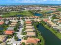 Aerial view of home with a pond view in a community near the water at 531 Latitude Ln, Osprey, FL 34229