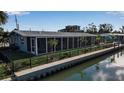 Beautiful waterfront home with a screened lanai and boat dock at 765 Saint Judes N Dr, Longboat Key, FL 34228