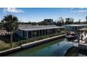 Beautiful waterfront home with a screened lanai and boat lift at 765 Saint Judes N Dr, Longboat Key, FL 34228