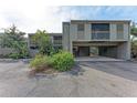 Condo building featuring muted color, parking below units, and native landscaping at 362 Pine Run Dr, Osprey, FL 34229