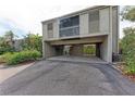 A exterior shot of the condo showing the parking area and muted exterior at 362 Pine Run Dr, Osprey, FL 34229