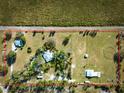 Aerial view of the property showcasing the home, surrounding land, and defined property lines at 4939 Myakka Valley Trl, Sarasota, FL 34241