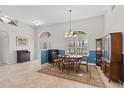 Cozy dining room with a chandelier, a round table, and an accent rug at 7518 Paspalum, Punta Gorda, FL 33955