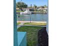 Beautiful waterfront view with boat dock and lush landscaping; ideal for boaters at 4900 38Th S Way # 201, St Petersburg, FL 33711