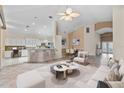 Inviting living area with open floor plan, bar seating, and contemporary furnishings at 6211 Skyward Ct, Bradenton, FL 34203