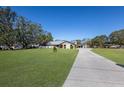 Charming single-story home boasts a large, well-maintained yard and lengthy driveway leading to a detached garage at 6615 13Th E Ave, Bradenton, FL 34208