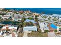 Waterfront home boasts stunning water views, lush landscaping, and proximity to the water at 609 Foxworth Ln, Holmes Beach, FL 34217