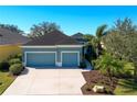 Inviting single-Gathering home with a spacious driveway, lush landscaping, and a well-maintained lawn at 2006 Red Lake Run, Bradenton, FL 34211