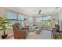 Bright living room features water views, comfortable seating and light wood flooring at 4320 Falmouth Dr # 301, Longboat Key, FL 34228