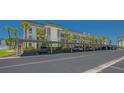 Exterior view of the covered parking area surrounded by lush landscaping at 4320 Falmouth Dr # 301, Longboat Key, FL 34228