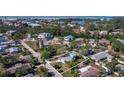 Charming coastal home with lush greenery, close to the beach and the calm lake waters at 651 Fox St, Longboat Key, FL 34228