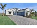 Attractive two-story home featuring a paver driveway and two car garage at 17903 Palmiste Dr, Bradenton, FL 34202