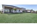 Spacious backyard features a well-maintained lawn and mature landscaping at 17915 Palmiste Dr, Bradenton, FL 34202