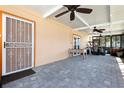 Spacious screened patio with tile floors, ceiling fans, and access to the backyard and other areas of the home at 2822 Maple Ave, Sarasota, FL 34234