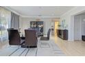 Elegant dining room with modern furniture, stylish decor, and abundant natural light at 4147 Augustine Ave, Sarasota, FL 34231