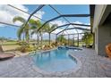 Screened-in pool and spa area offers privacy and tropical landscaping at 7812 Birdie Bend Way, Sarasota, FL 34241