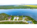 Aerial view of a neighborhood featuring waterfront homes along Interceptor Lagoon and Charlotte Harbor at 9464 St Marys Ct, Port Charlotte, FL 33981