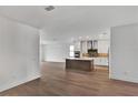 Spacious, open-concept kitchen with stainless steel appliances and a center island, creating a modern and inviting atmosphere at 12719 Sunbridge Dr, Venice, FL 34293