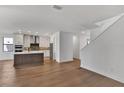 Modern kitchen with stainless steel appliances, an island, and ample natural light creating a comfortable living space at 12719 Sunbridge Dr, Venice, FL 34293