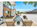 A luxurious pool area featuring elegant outdoor seating, modern design, and serene poolside ambiance at 2149 Hyde Park St, Sarasota, FL 34239