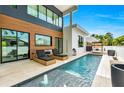 Backyard pool with lounge chairs, modern design, and serene poolside views at 2149 Hyde Park St, Sarasota, FL 34239