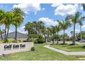 Well maintained community sign for Gulf Gate East surrounded by lush green lawn and mature palm trees at 3739 Kingston Blvd, Sarasota, FL 34238