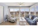 Inviting living room features large windows, comfortable seating and scenic water views at 4390 Exeter Dr # I305, Longboat Key, FL 34228