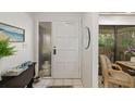 Welcoming entryway features a stylish front door, decorative accents, and a glimpse of the interior space at 6650 Schooner Bay Cir # 6650, Sarasota, FL 34231