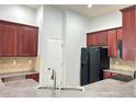 Well-lit kitchen with stainless steel appliances and ample cabinet space for all your cooking essentials at 6768 Breezy Palm Dr, Riverview, FL 33578