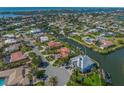 Sprawling neighborhood showcasing canal, waterfront living, lush landscaping and beautiful homes at 364 El Greco Dr, Osprey, FL 34229