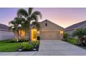 Beautiful single-Gathering home with lush landscaping, a spacious driveway, and an inviting entrance at 4221 Park Willow Ave, Palmetto, FL 34221