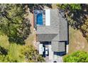 Aerial view of the home with a screened pool and RV parking at 14204 Upper Manatee River Rd, Bradenton, FL 34212