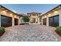 Lovely house showcasing a beautifully brick driveway and multi-car garage at 14733 Como Cir, Lakewood Ranch, FL 34202