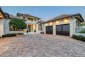 Gorgeous home featuring a well manicured lawn, large driveway and multi-car garage at 14733 Como Cir, Lakewood Ranch, FL 34202