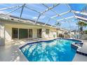 Enclosed pool features a screen enclosure, providing a relaxing outdoor oasis with refreshing blue water at 4410 Murfield E Dr, Bradenton, FL 34203