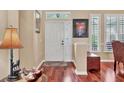 Elegant entryway with hardwood floors, decorative accents, and a bright, welcoming atmosphere at 13811 Nighthawk Ter, Lakewood Ranch, FL 34202