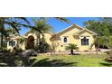Beautiful home showcasing vibrant landscaping, a well-maintained lawn, and a welcoming facade at 15207 17Th E Ave, Bradenton, FL 34212
