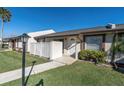 Inviting townhome with a well-kept lawn and a quaint, fenced-in front porch at 3403 36Th W St # 109, Bradenton, FL 34205